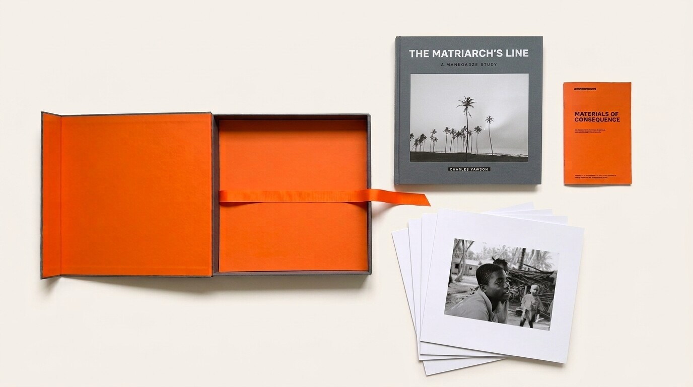 The Collector's Edition components arranged in a flat lay: open gray cloth clamshell with orange Sirio Arancio interior and horizontal orange ribbon; the cloth-bound book with tipped-in photograph; the Materials of Consequence booklet in orange; and a stack of loose plates from the folio with a portrait on top.